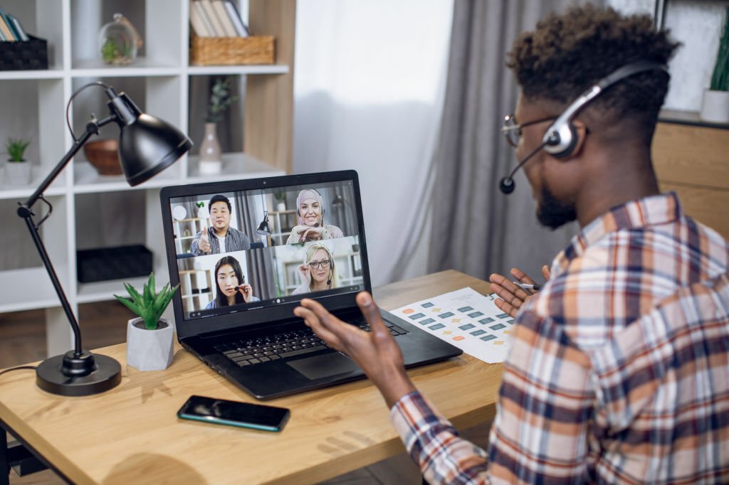 A young black man working remotely