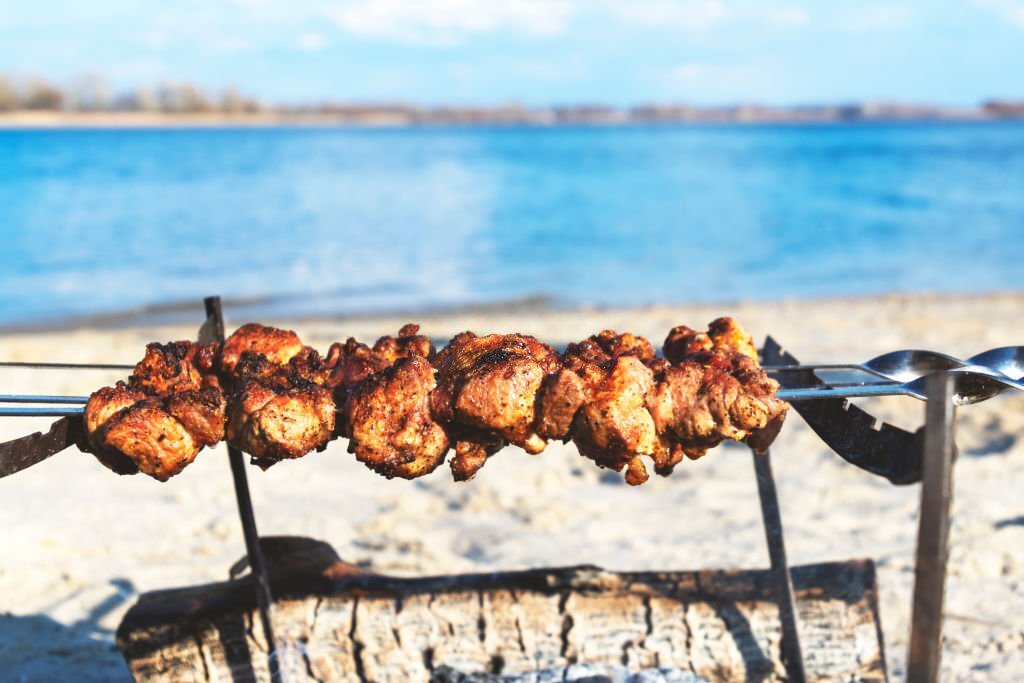 A barbecue prepared at the beach for friends' hangout.