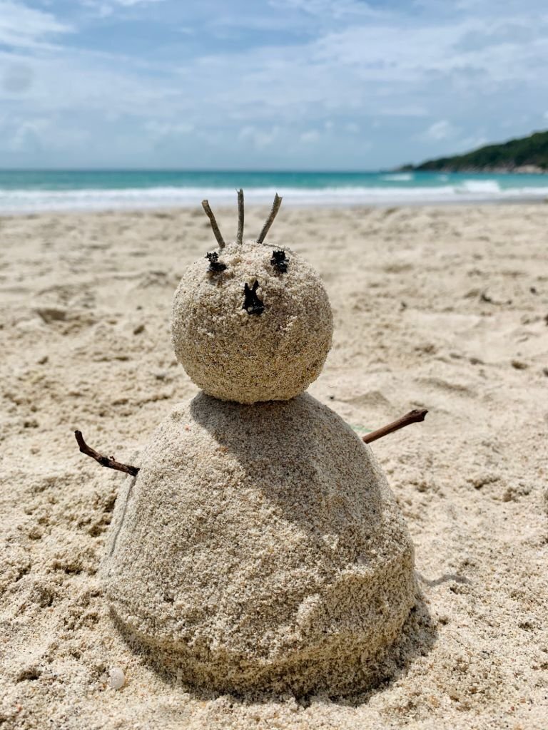 A sandman made by some friends with beach sand, an exciting game and activity for your next hangout at the beach.