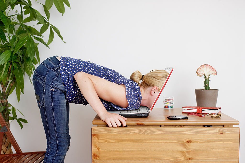 A woman looking into her laptop figuring out how to make money online