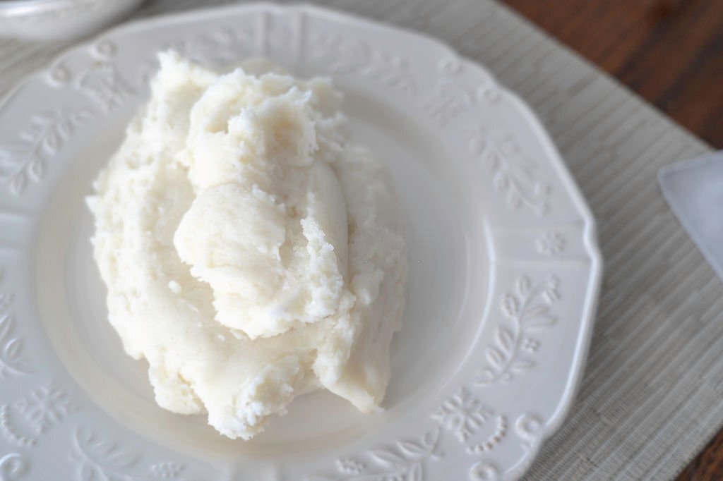 Nigerian Pounded yam on white plate ready to eat