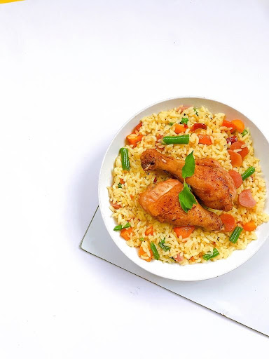 A-plate-of-fried-rice-with-some-chicken-tasty-Nigerian-food