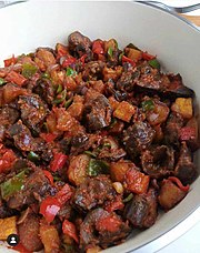 Peppered gizzard and plantain in a bowl