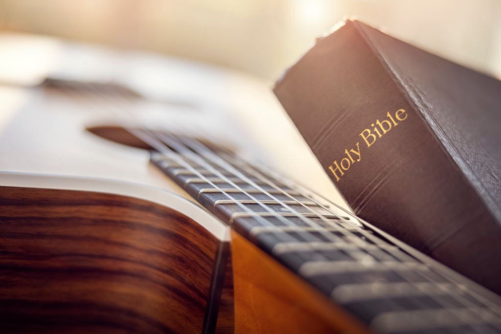 Holy-Bible-with-acoustic-guitar